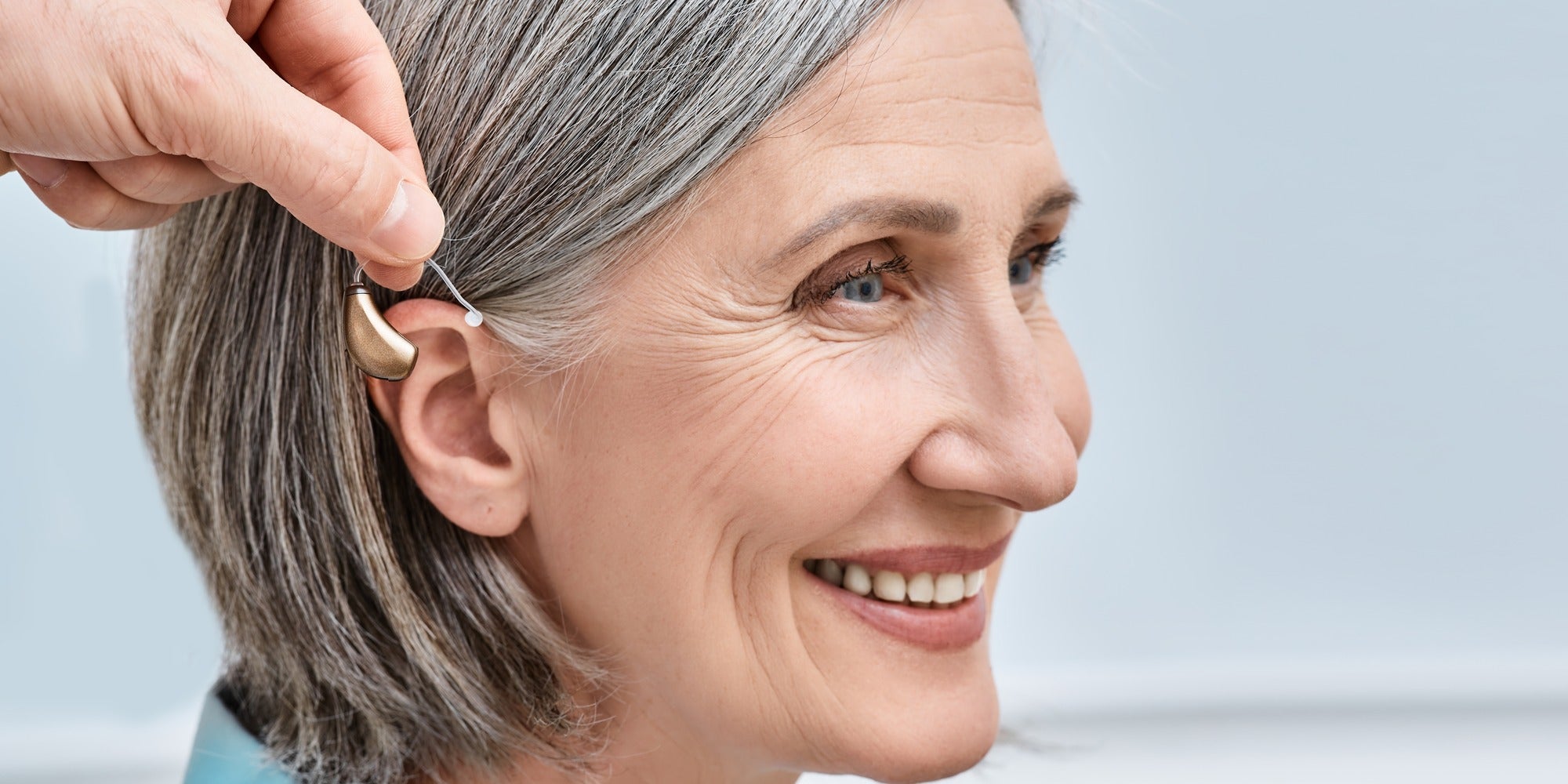 woman being fitted with hearing aid